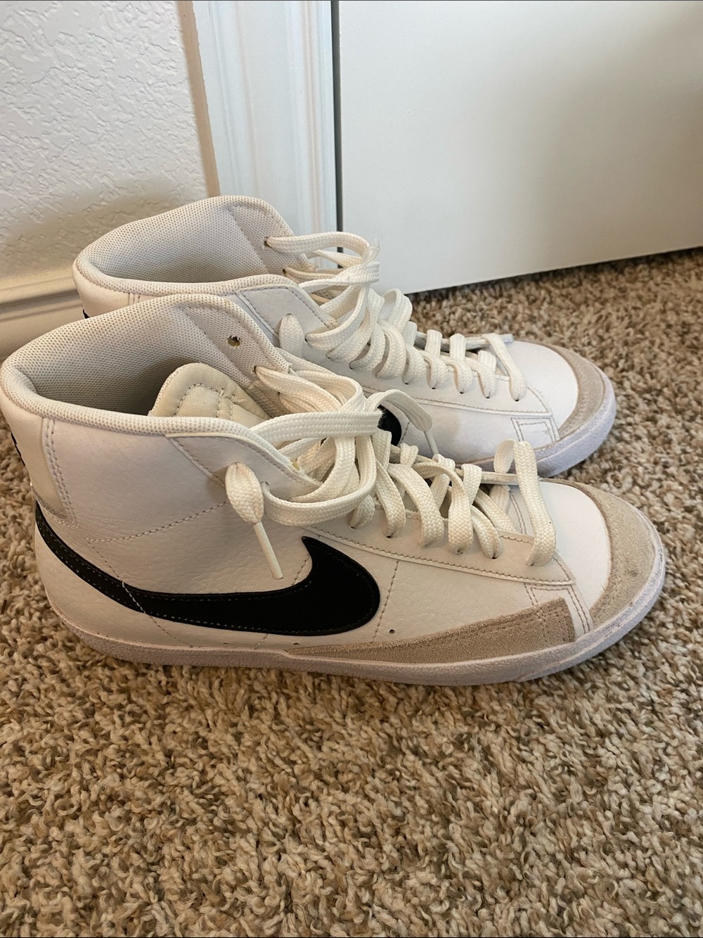 Nike White High-Top Sneakers with Black Swoosh